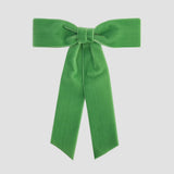 Apple green Zoe petite velvet hair bow on a white background.