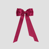 Azalea pink bow on a white background