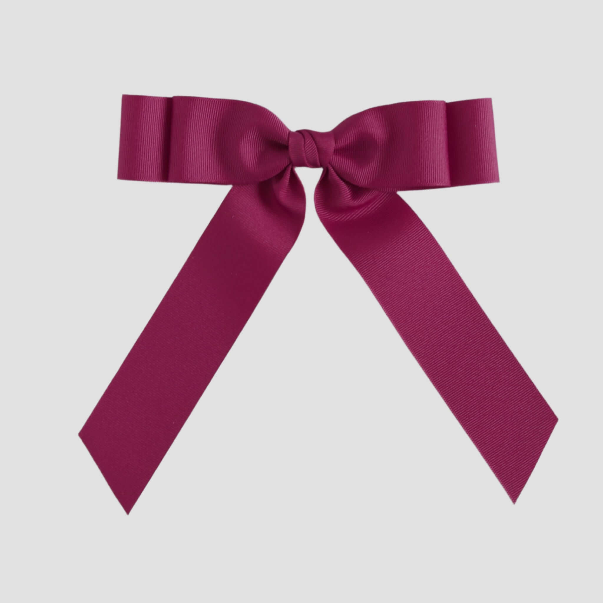 Azalea pink bow on a white background