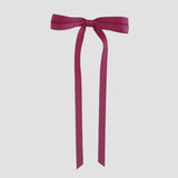 Azalea ribbon bow on a white background