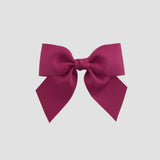 Azalea pink bow on a white background