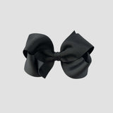Black hair bow on a white background