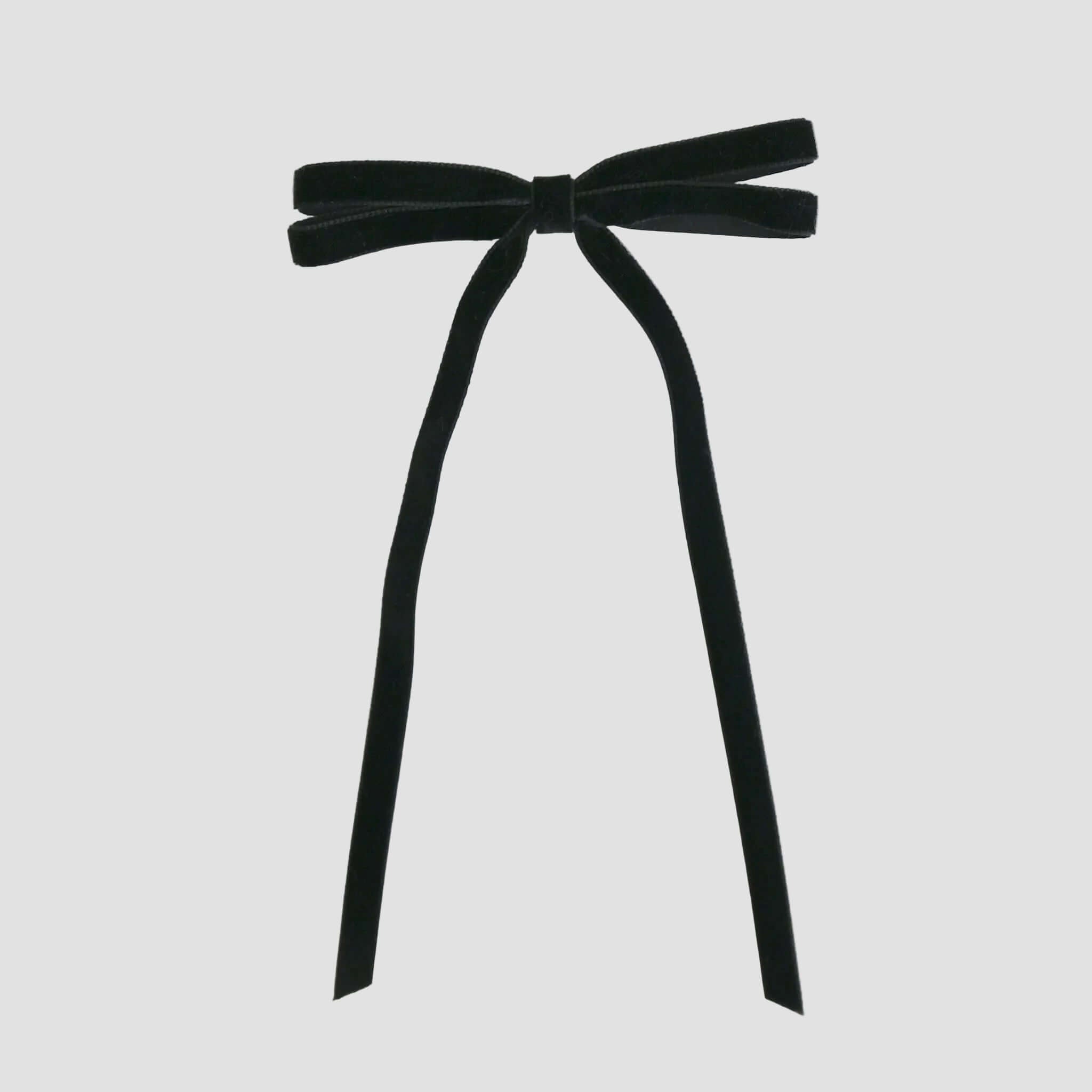 Black Olivia velvet hair bow for women with long tails on white background