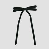 Black Olivia velvet hair bow for women with long tails on white background