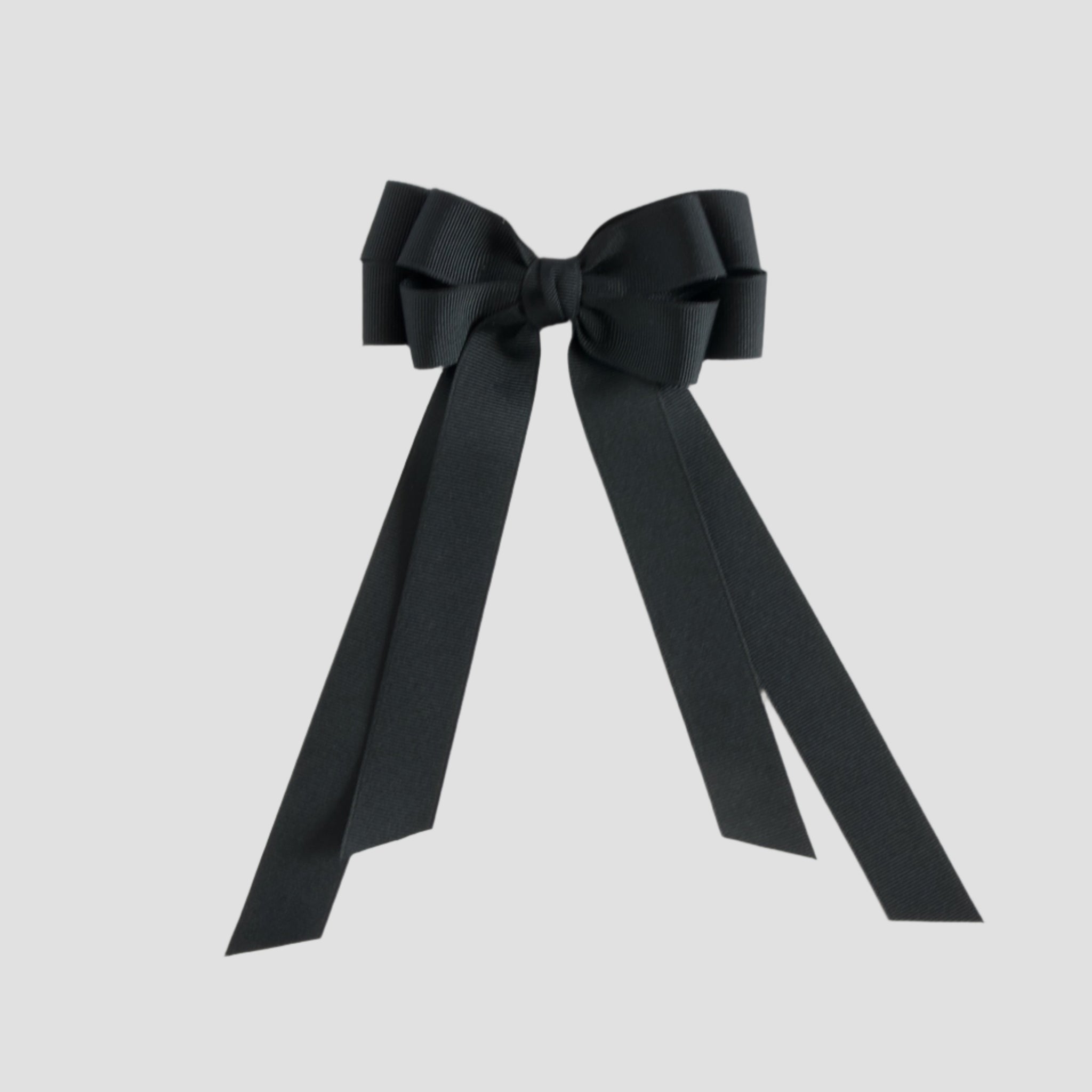 Black bow with long tails on a white background