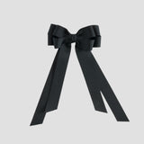 Black bow with long tails on a white background