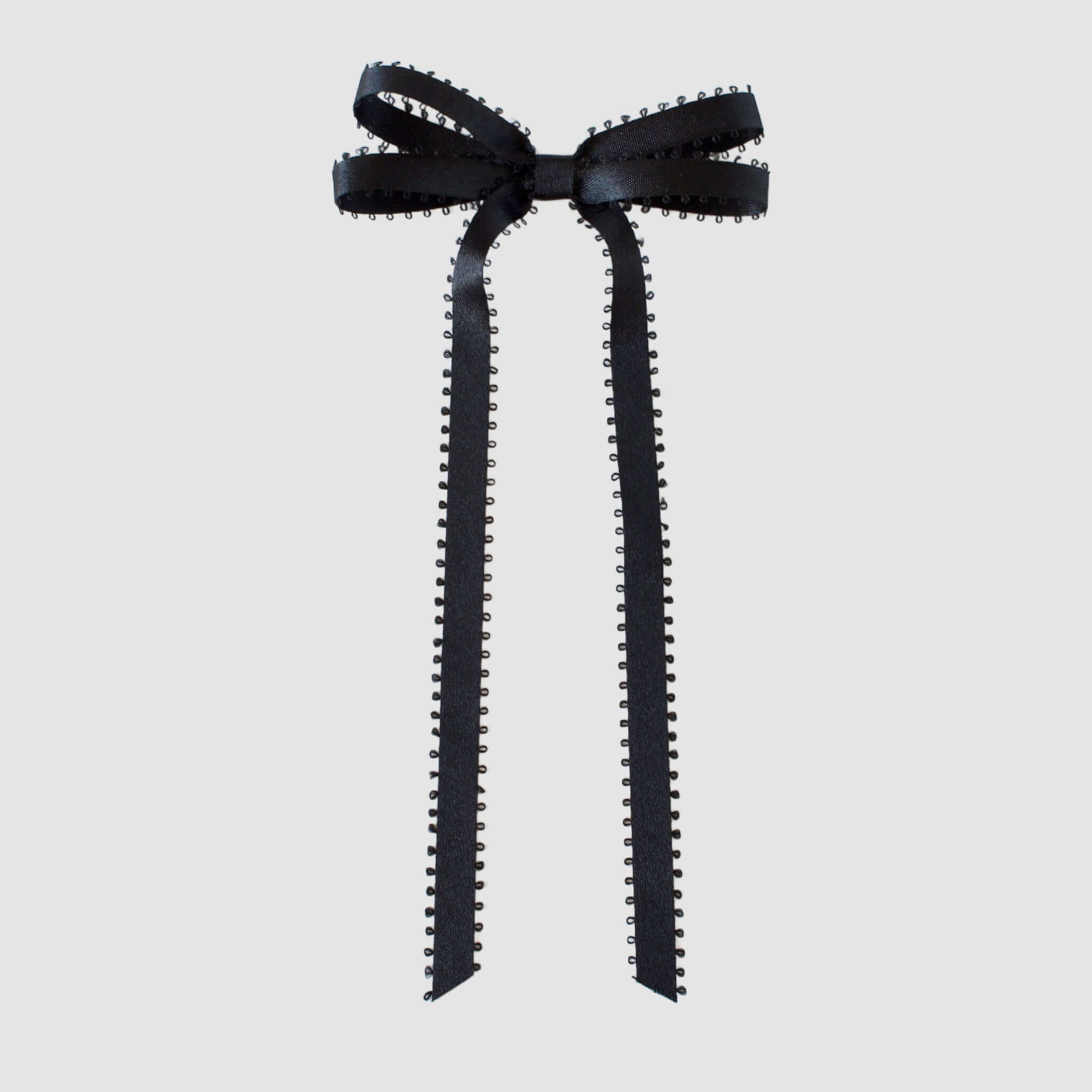 Olivia Picot Satin Bow in black with picot edges, elegant hair accessory for women and girls, featuring alligator clip.