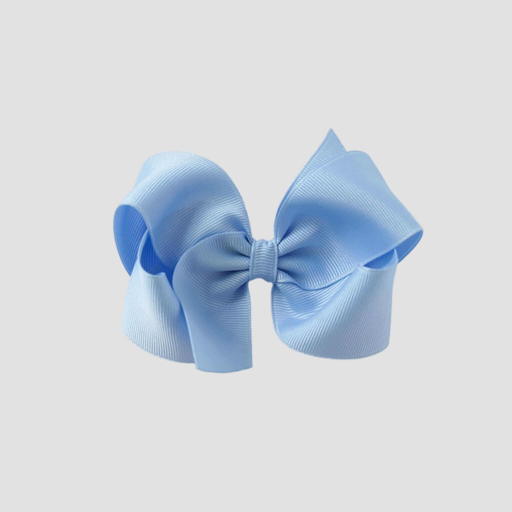 Light blue hair bow on a white background