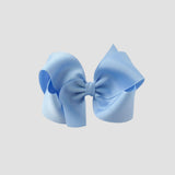 Light blue hair bow on a white background