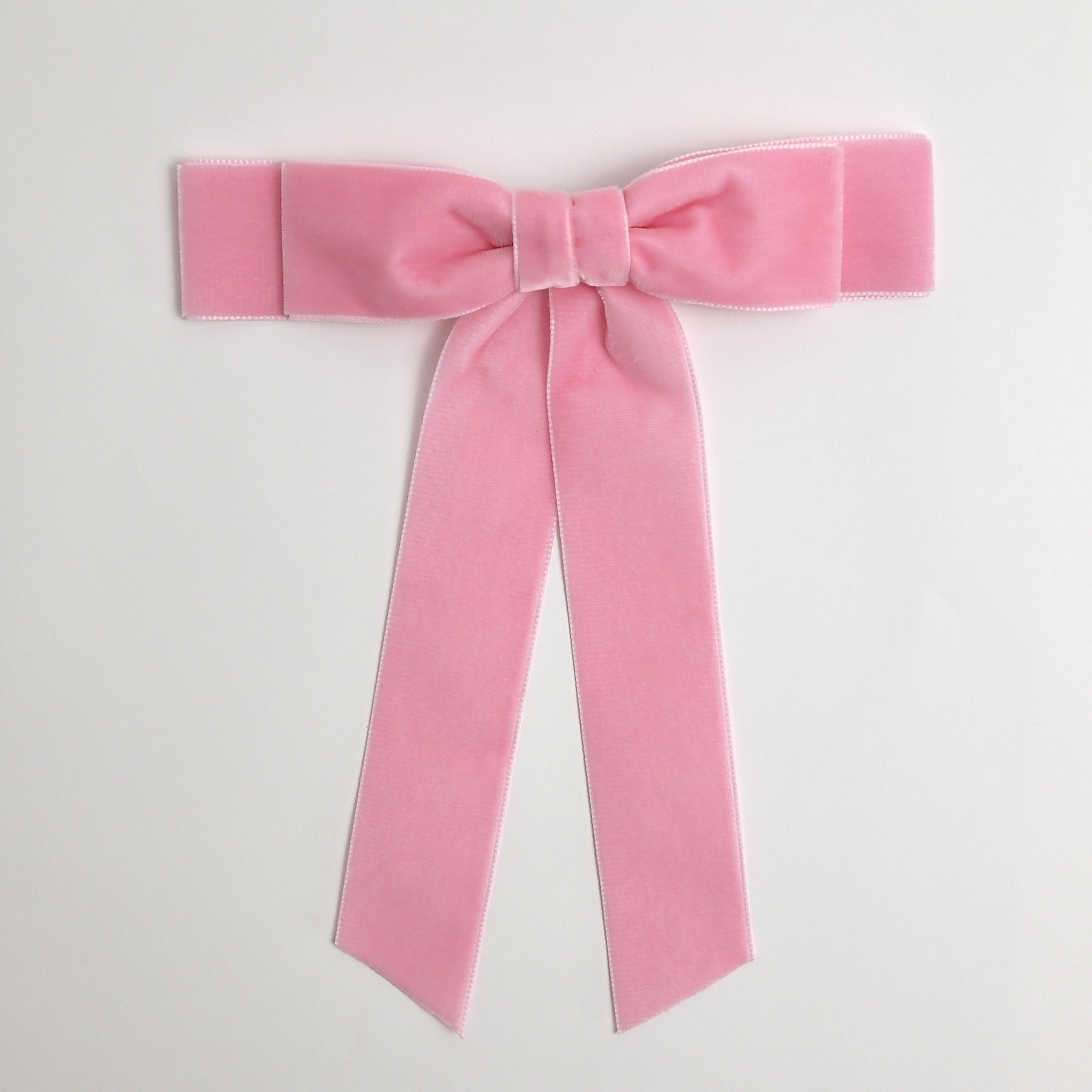 Blush pink Grace velvet hair bow for women. Double bow with long tails on white background 