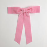 Blush pink Grace velvet hair bow for women. Double bow with long tails on white background 
