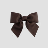 Brown hair bow on a white background