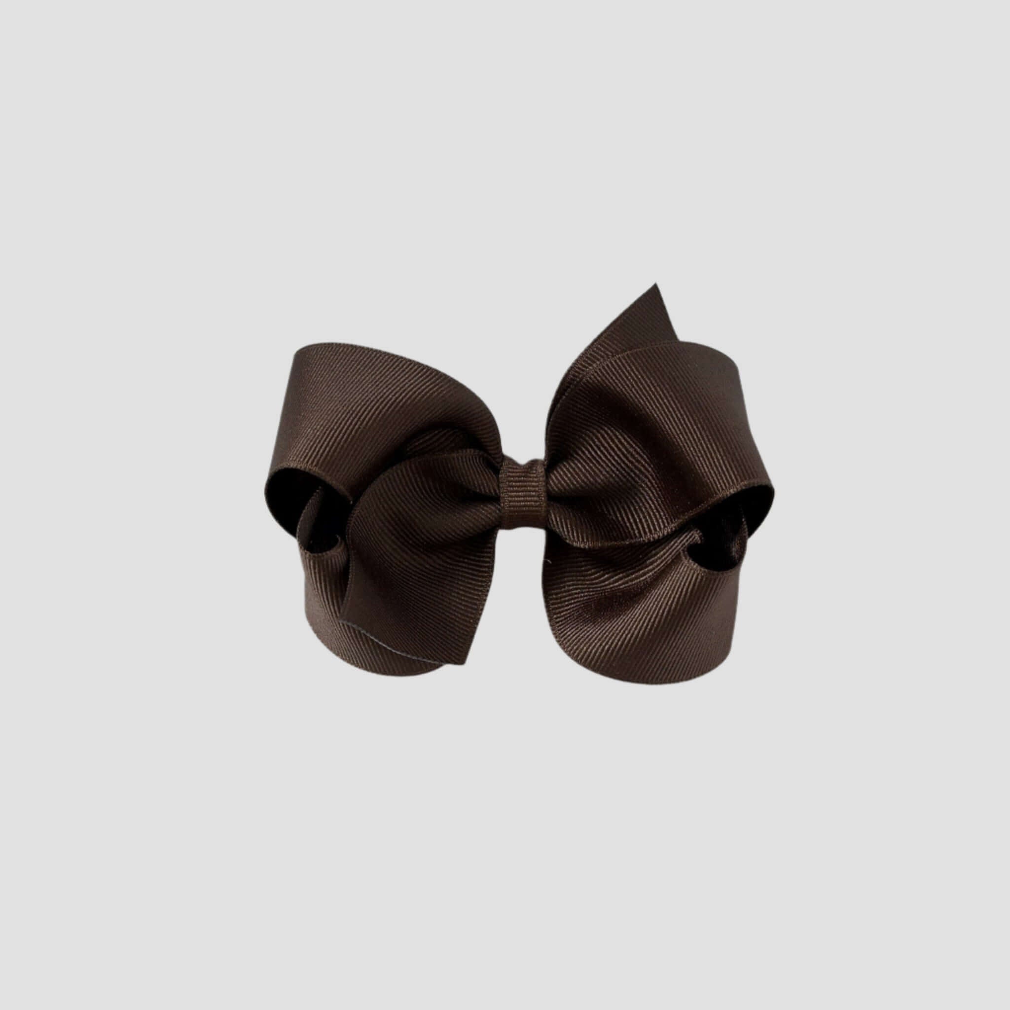 Brown hair bow on a white background