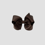 Brown hair bow on a white background