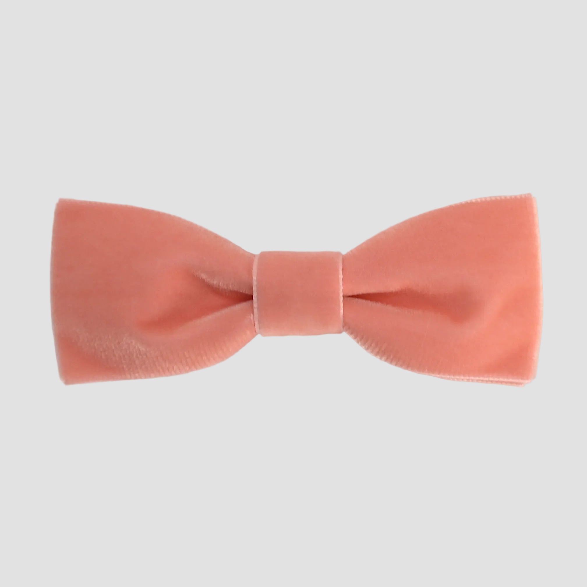 Coral orange men bow tie on a white background.