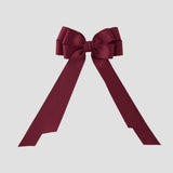 Cranberry red grosgrain Emerson bow on a white background
