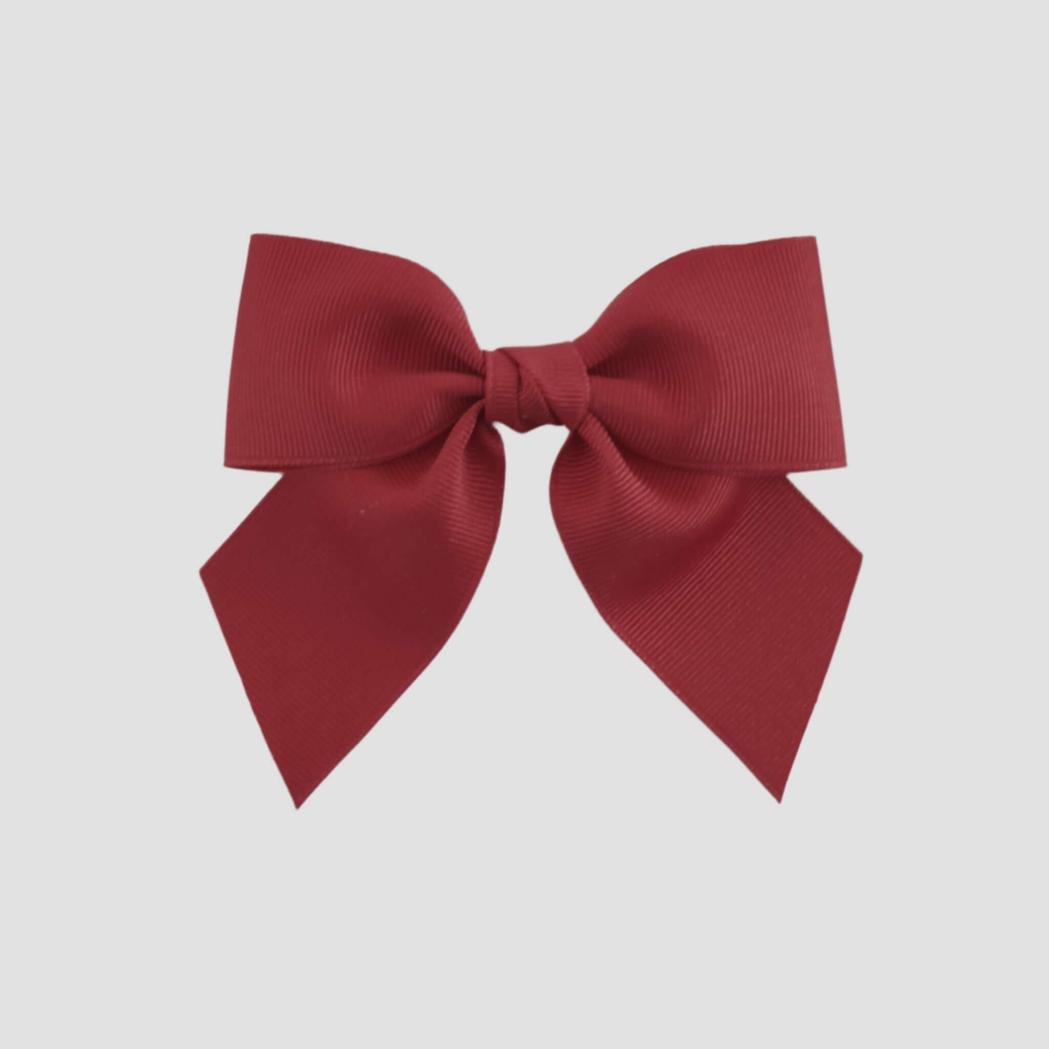 Cranberry red bow on a white background