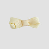 Cream bow on a white background