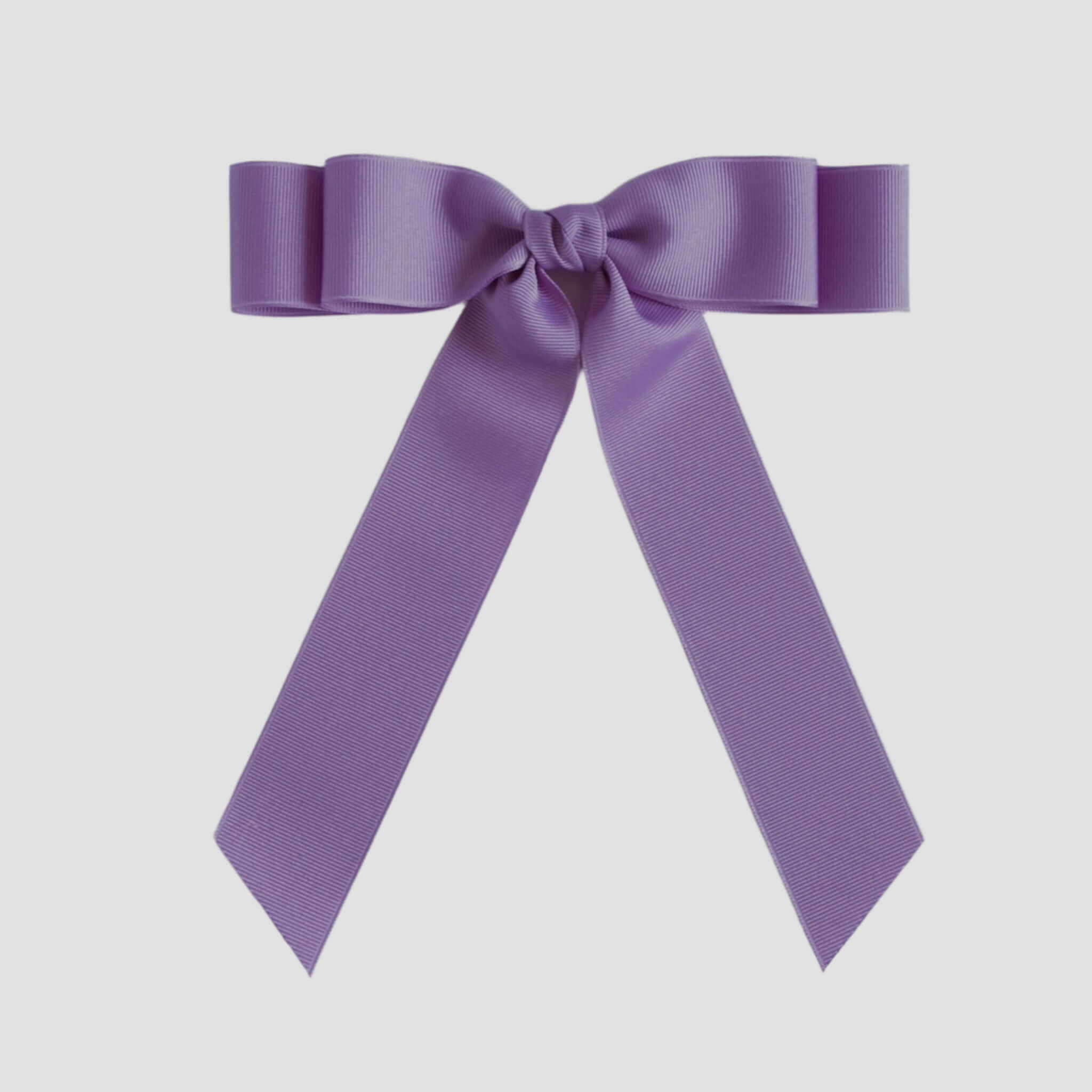 Dark orchid purple ribbon bow on a white background