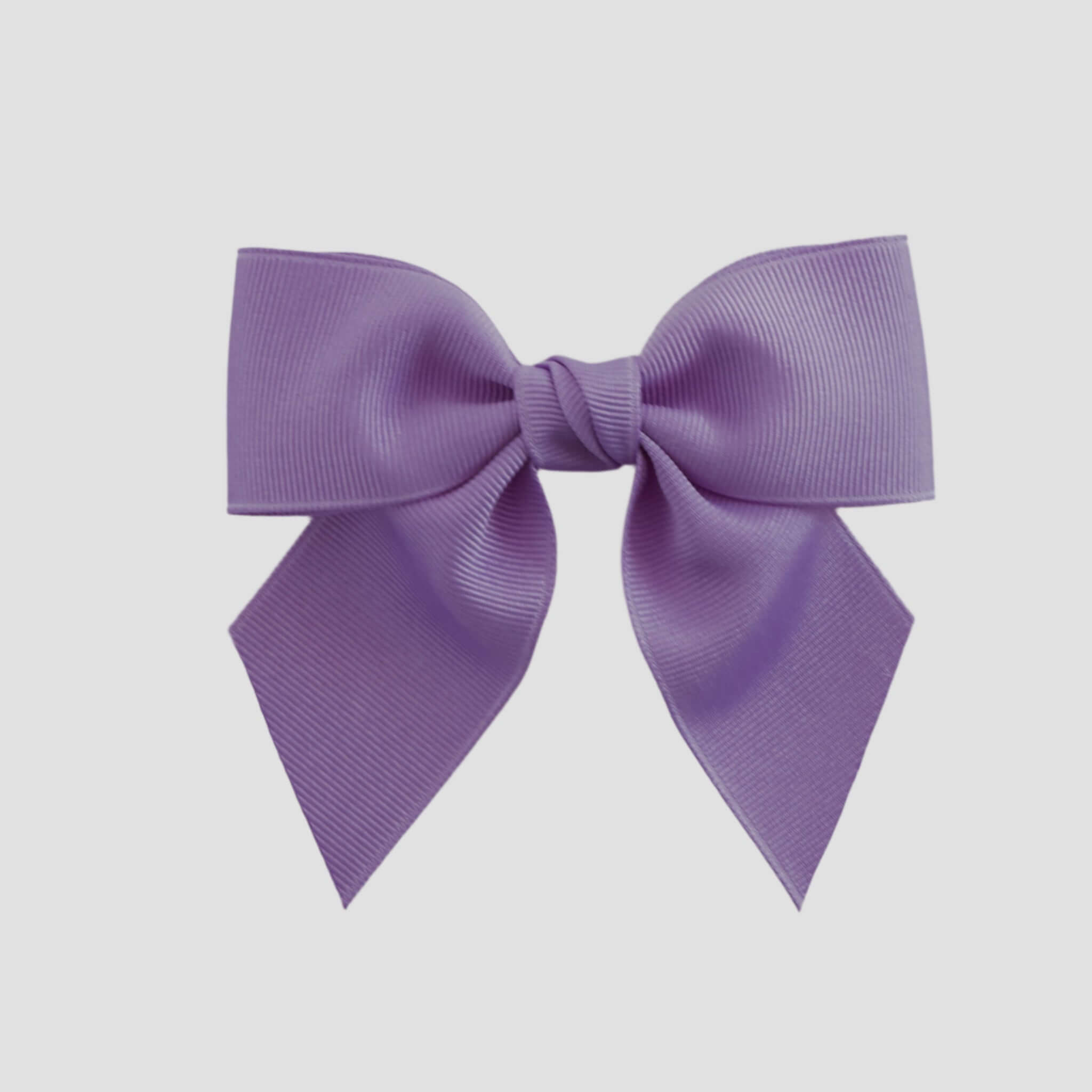 Dark orchid purple bow on a white background
