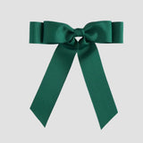 Forest green bow on a white background