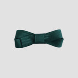 Forest green bow tie on a white background