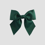 Forest green bow on a white background