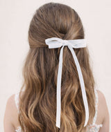 young girls wearing white Olivia velvet hair bow in a half-up hairstyle