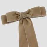 Close up details of the Grace velvet bow in taupe.