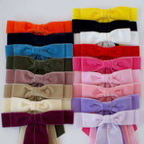 Elegant hair accessory: velvet bows for polished looks.