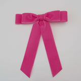 Bright pink hair bows for the concert lovers. 