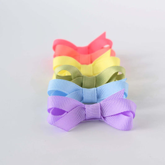 Set of 6 pastel mini grosgrain bows for babies and toddler girls in a row showcasing pastel colors, perfect hair accessory.