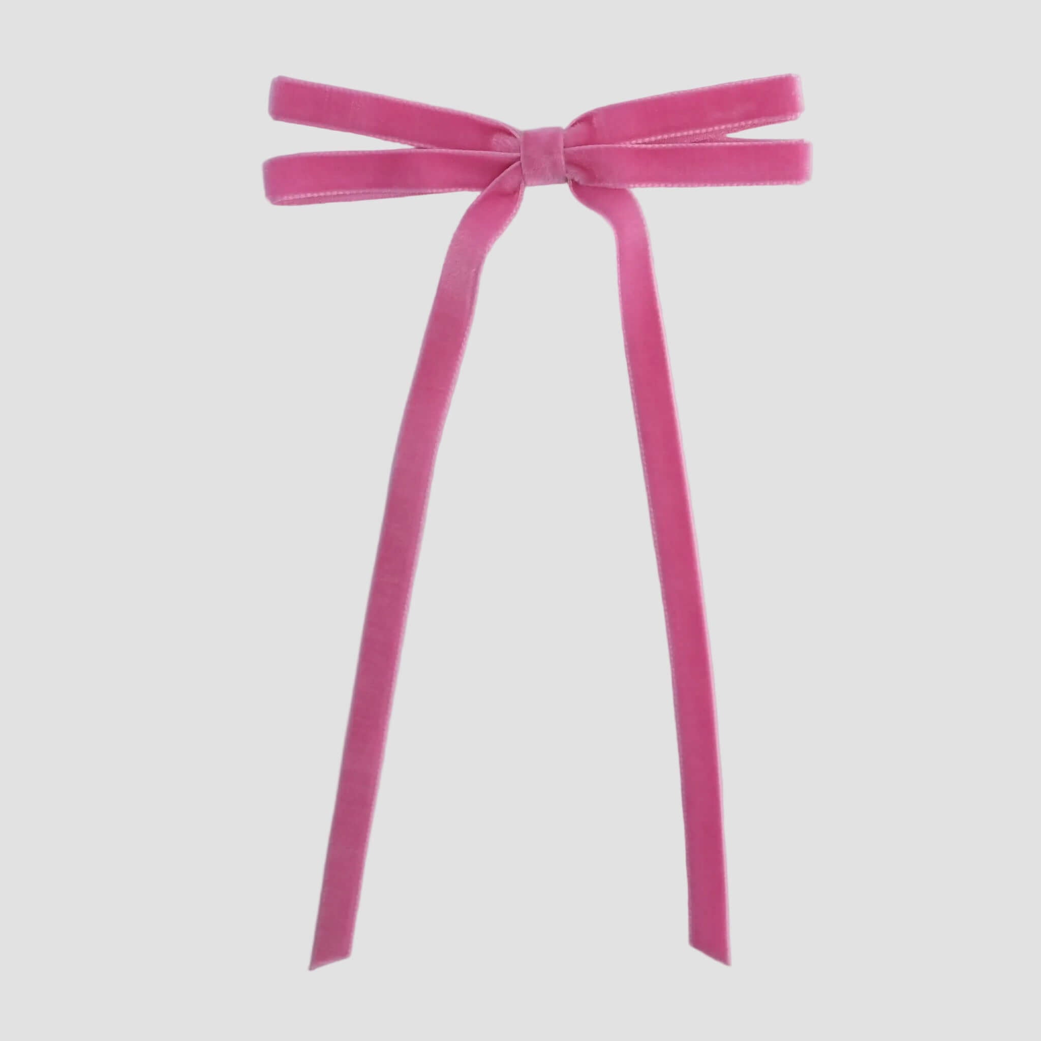 Hot pink Olivia velvet hair bow for women with long tails on white background