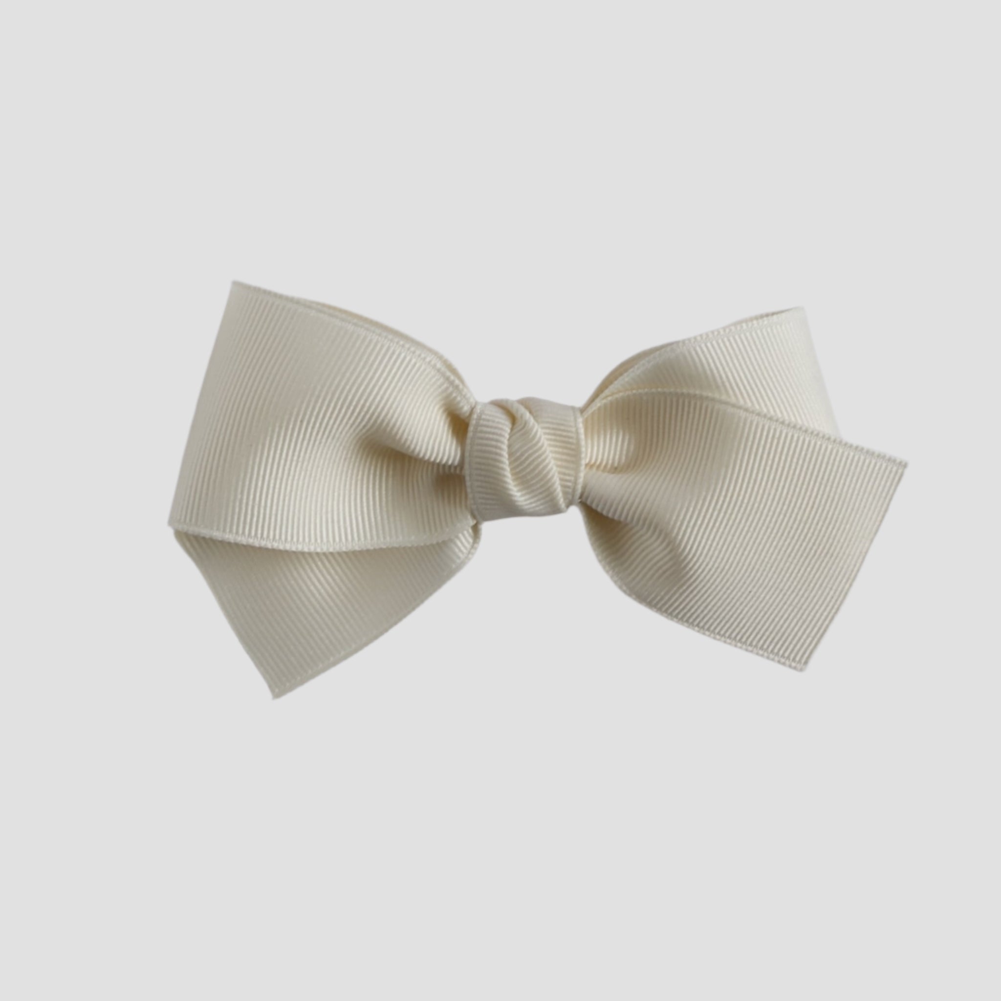 ivory colored bow on white background