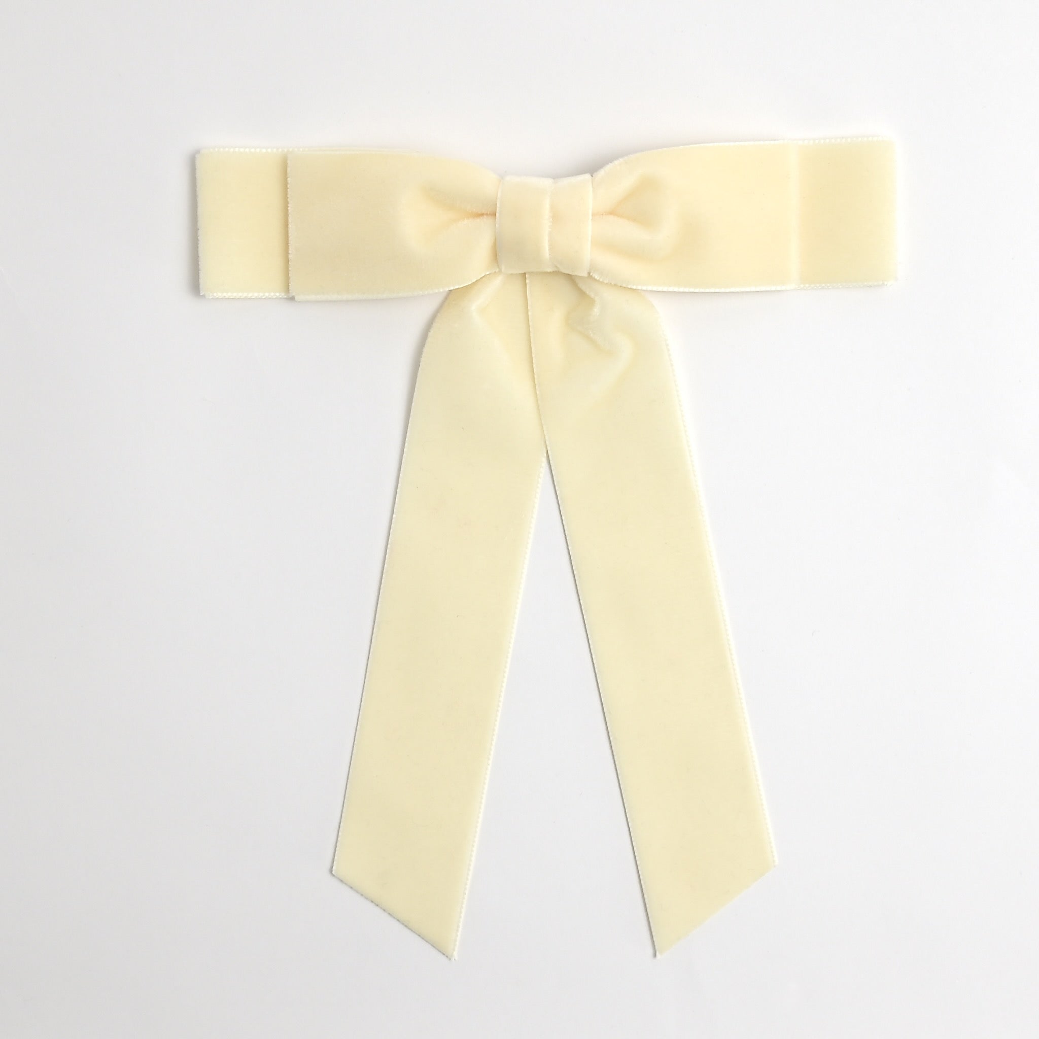 Ivory Grace velvet hair bow for women. Double bow with long tails on white background 