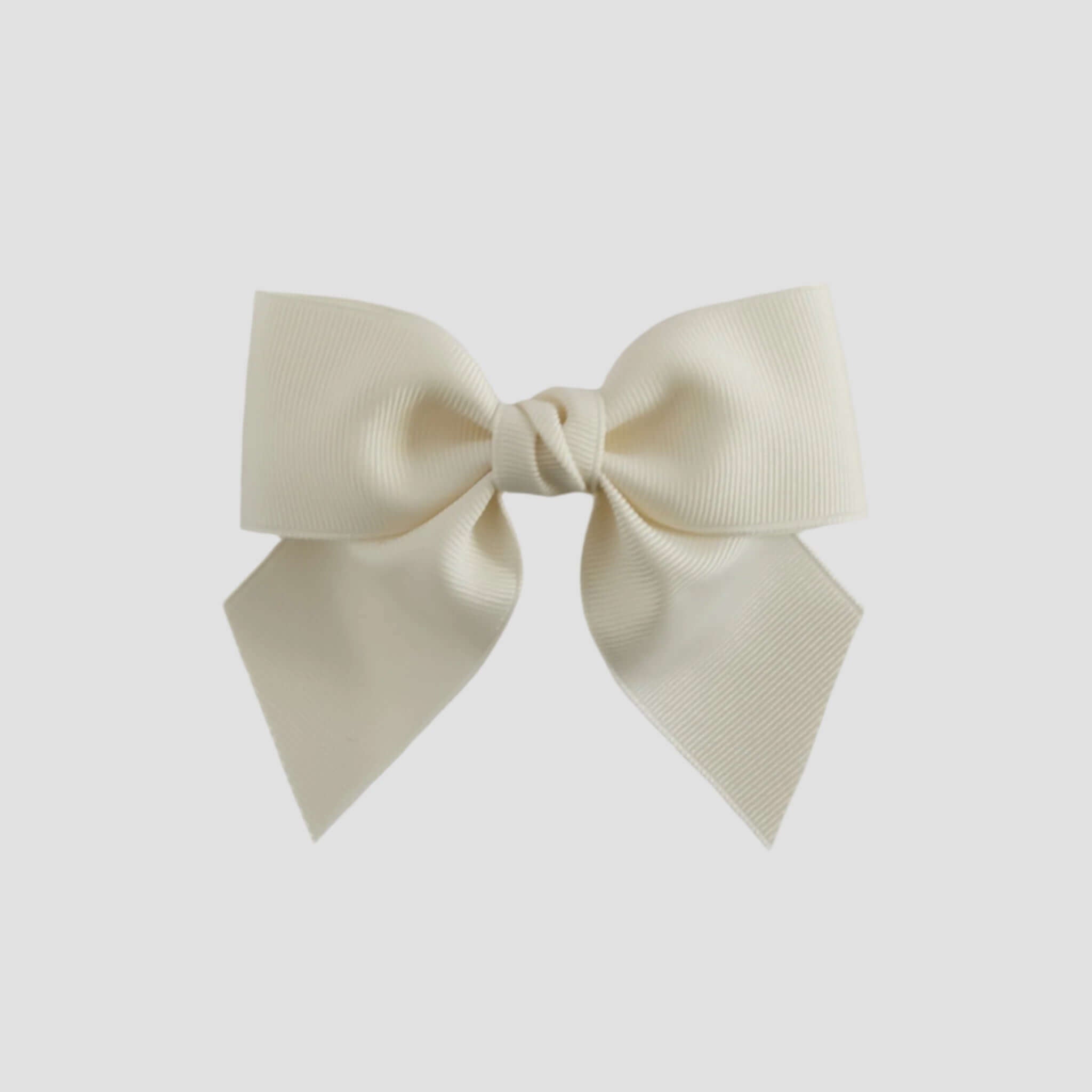 Ivory colored bow on a white background
