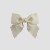 Ivory colored bow on a white background