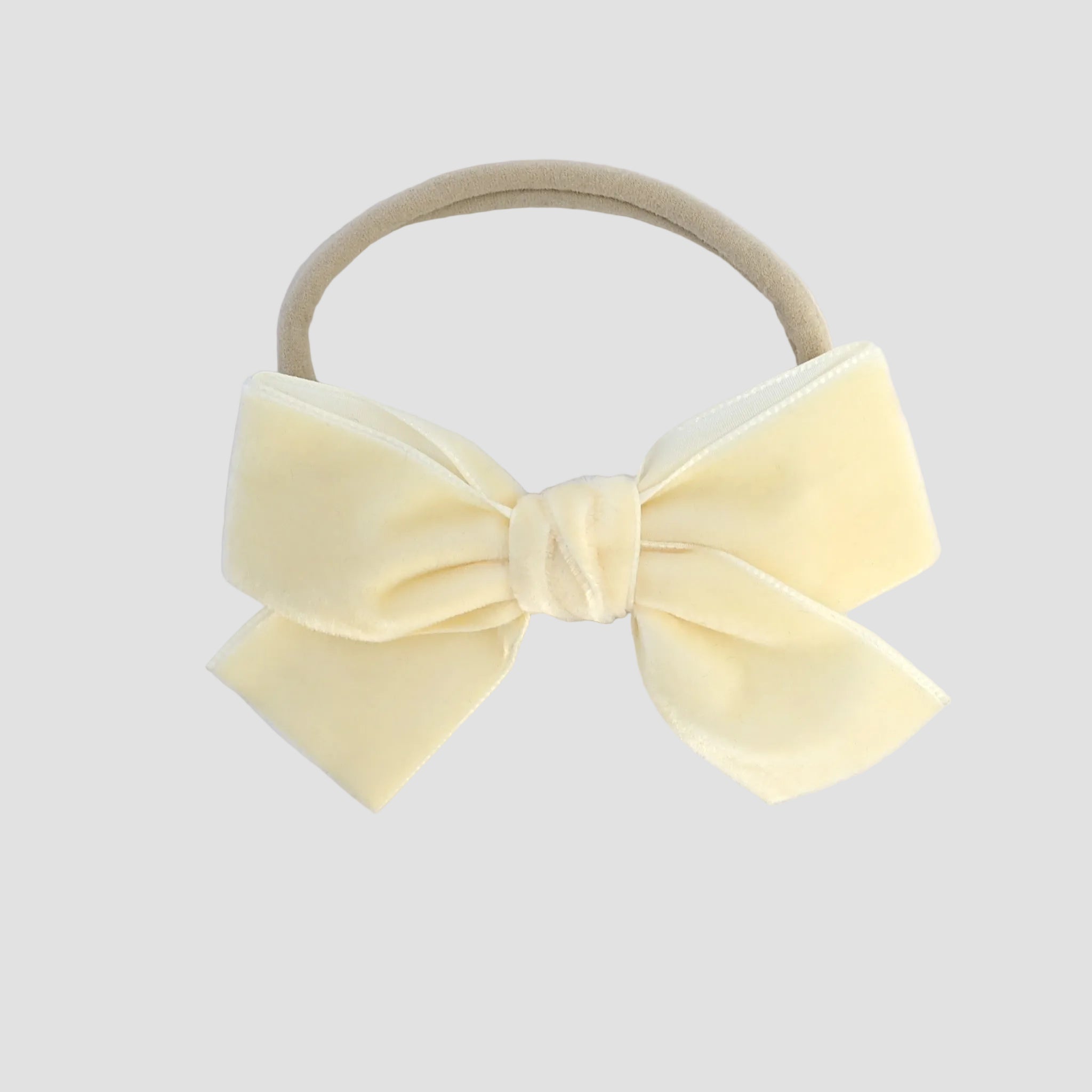 Ivory Kayla velvet hair bow headband for baby girl.