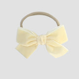 Ivory Kayla velvet hair bow headband for baby girl.