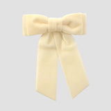 Ivory velvet Mia bow on a white background