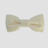 Ivory velvet bow tie on a white background