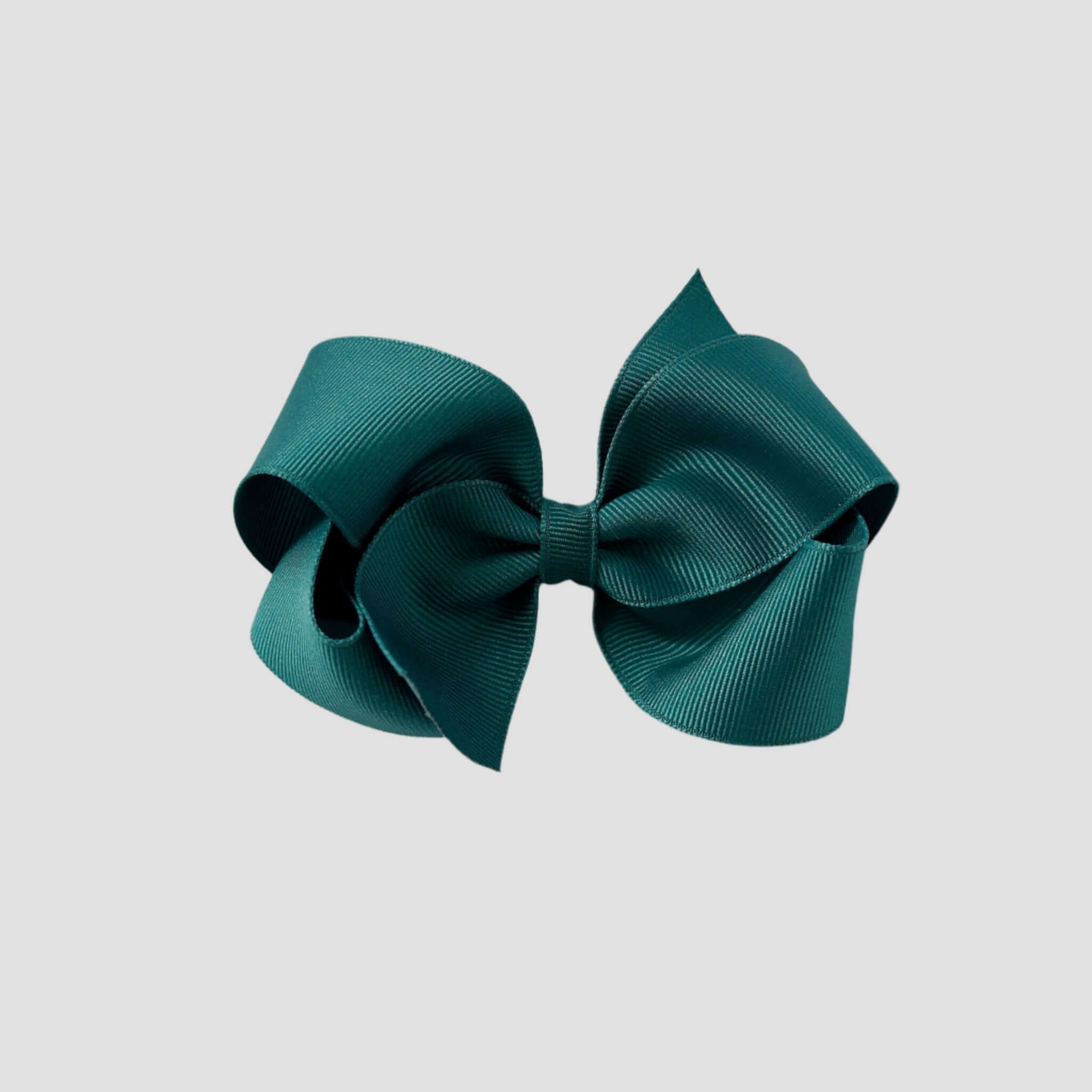 Jade hair bow on a white background