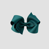Jade hair bow on a white background