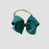 Jade blue bow on a nude nylon headband