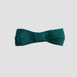 Jade green bow on a white background