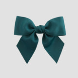 Jade green  hair bow on a white background