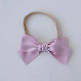 Sustainable recycled polyester matte satin bow headband for newborns to toddlers in lavender