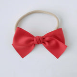 Sustainable recycled polyester matte satin bow headband for newborns to toddlers in red