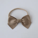 Sustainable recycled polyester matte satin bow headband for newborns to toddlers in taupe