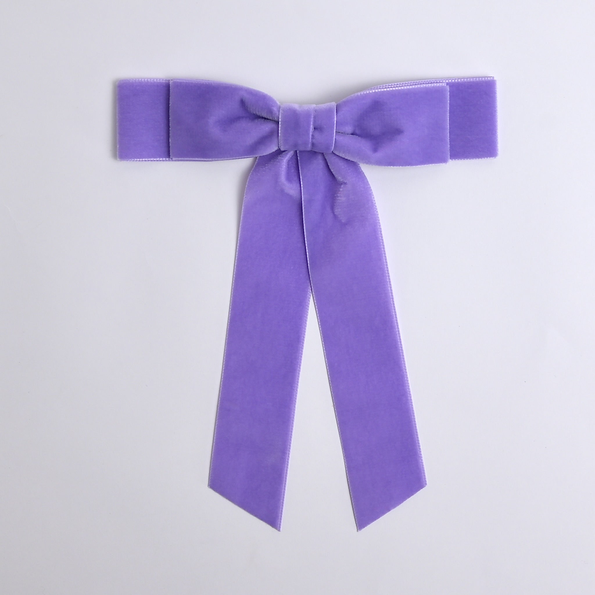 Lavender Grace velvet hair bow for women. Double bow with long tails on white background 